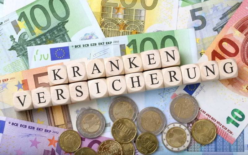 Krankenversicherung, assurance en français, écrit sur des dés. 