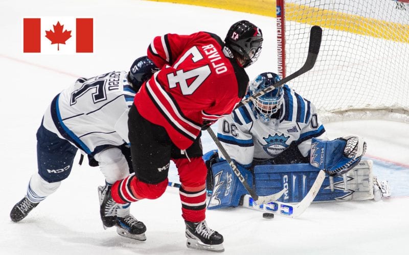 Joueur d'hockey sur glace au Canada essayant de marquer mais arrêt du gardien.